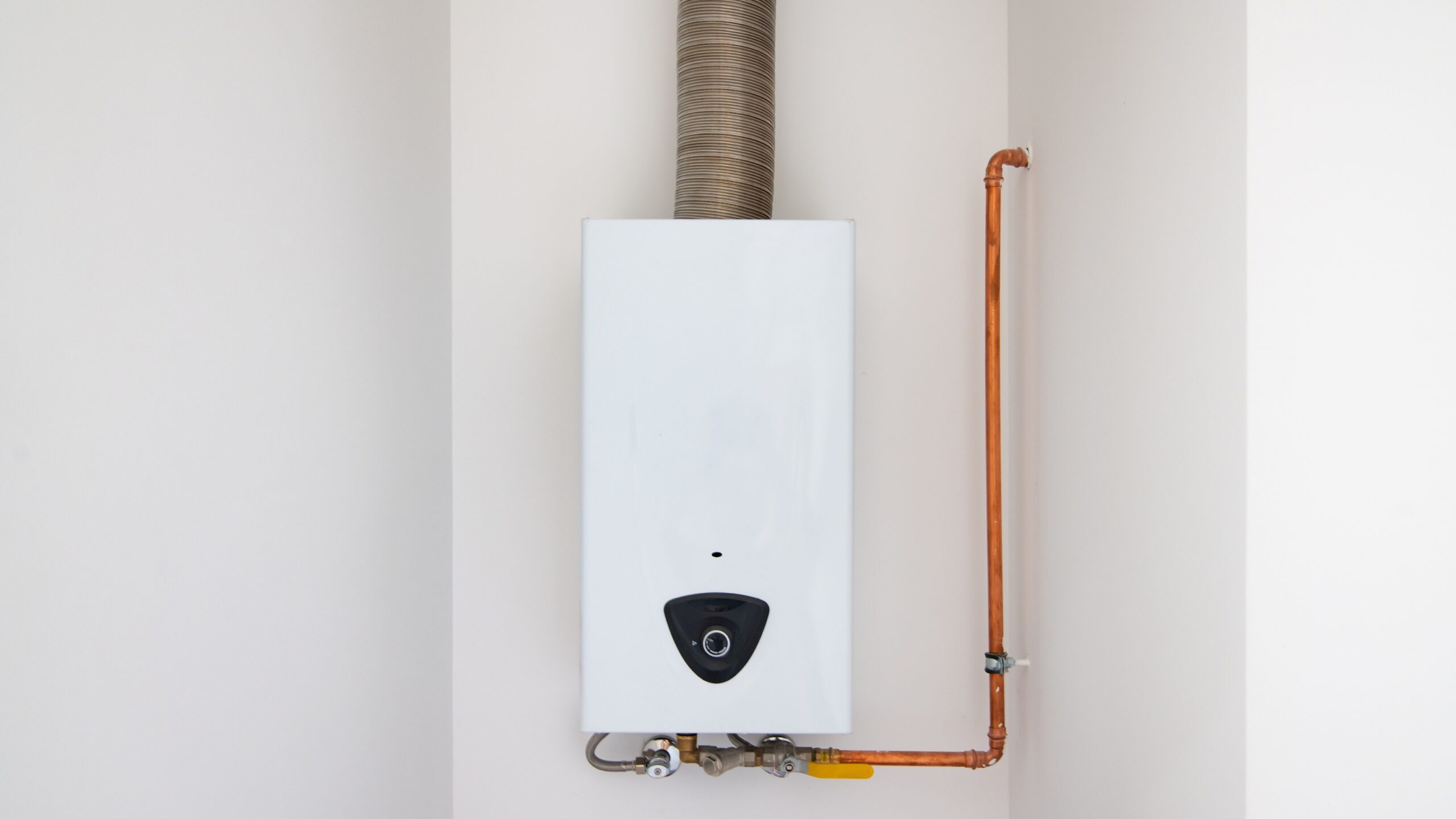 Wall-mounted combi boiler installed in a modern home