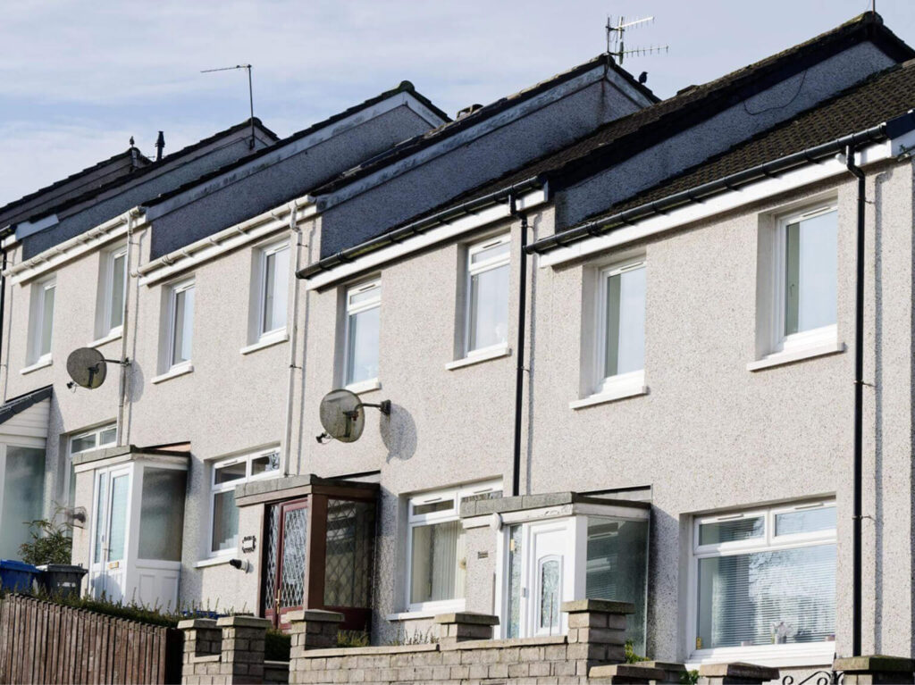 Row of UK residential properties representing managed housing portfolios