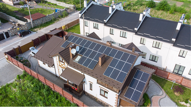 Modern residential home with rooftop solar panels installed to improve energy efficiency and reduce energy costs